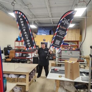 Custom printed feather flags in the Dolphies Promo workshop