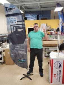 Custom printed feather flag on a cross base