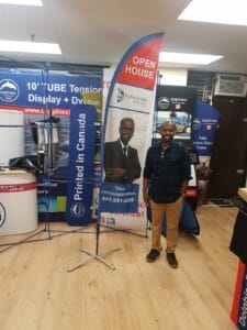 Custom printed feather flag in the Dolphies Promo showroom