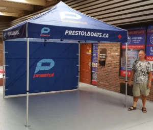 Navy printed canopy tent with a navy printed back wall, indoors
