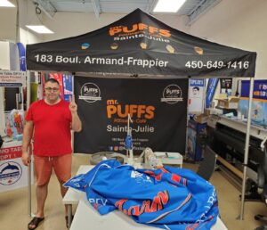 Black printed canopy tent with a printed back wall in a print shop