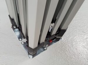 Close-up of hexagonal aluminum tent legs and a foot plate