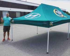 Teal printed canopy tent set up outdoors