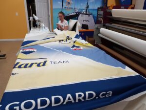 Printed canopy fabric with a beige and blue design on a work table