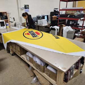 Yellow printed canopy fabric on a work table