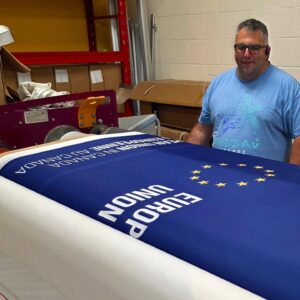 Navy printed canopy fabric on a heat press roller