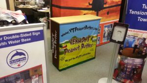 Pop up fabric counter with a colourful food graphic beside other displays