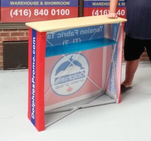 Back of a red pop up fabric counter showing the shelf inside