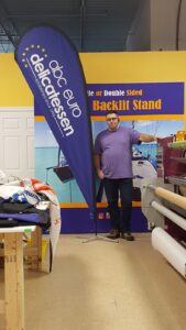 Navy custom printed teardrop flag in a print workshop