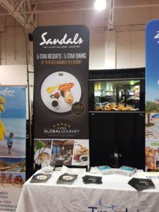 Black a 3 ft tube fabric display with a food photo at a trade show booth