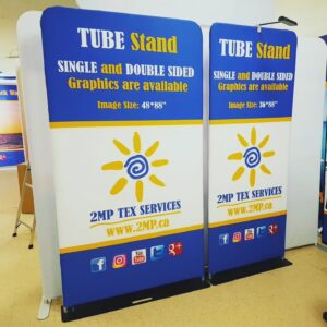 Two tube stands side by side with matching blue, white and yellow sun graphics