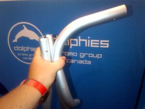 Hand holding a curved aluminum frame tube