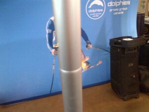 Close-up of a frame tube in front of a printed graphic